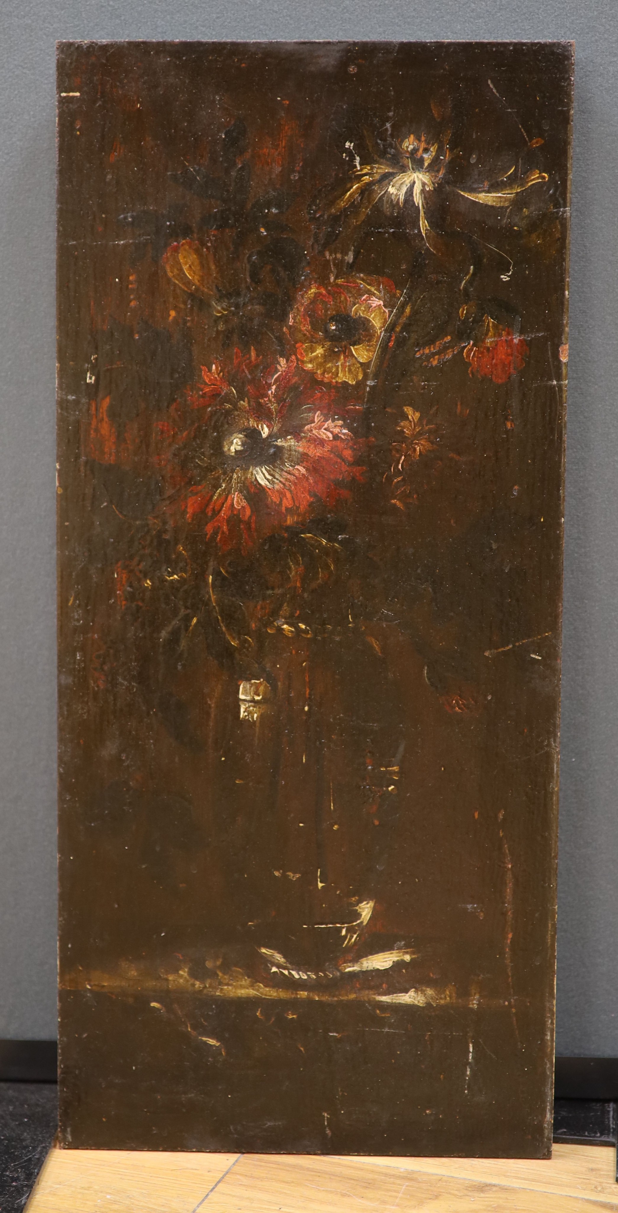 19th century Continental School, oil on wooden panel, Still life of flowers in a vase, 57 x 26cm, unframed
